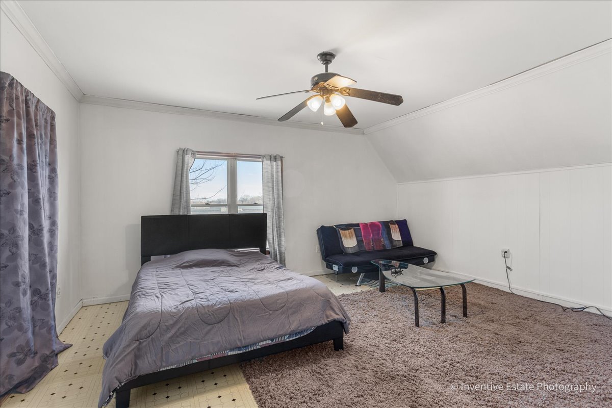 12018 South Loomis Street Chicago, IL 60643 - Photo 15 of 21 a bedroom with a bed and a chandelier