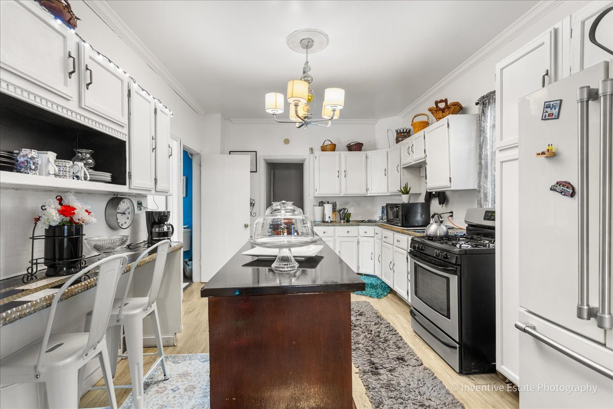 12018 South Loomis Street Chicago, IL 60643 - Photo 6 of 21 a kitchen with stainless steel appliances granite countertop a stove refrigerator and a sink