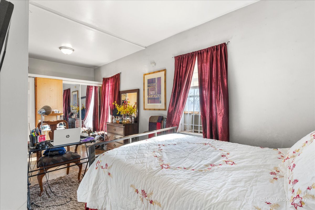 12018 South Loomis Street Chicago, IL 60643 - Photo 9 of 21 a bedroom with a bed and a large mirror