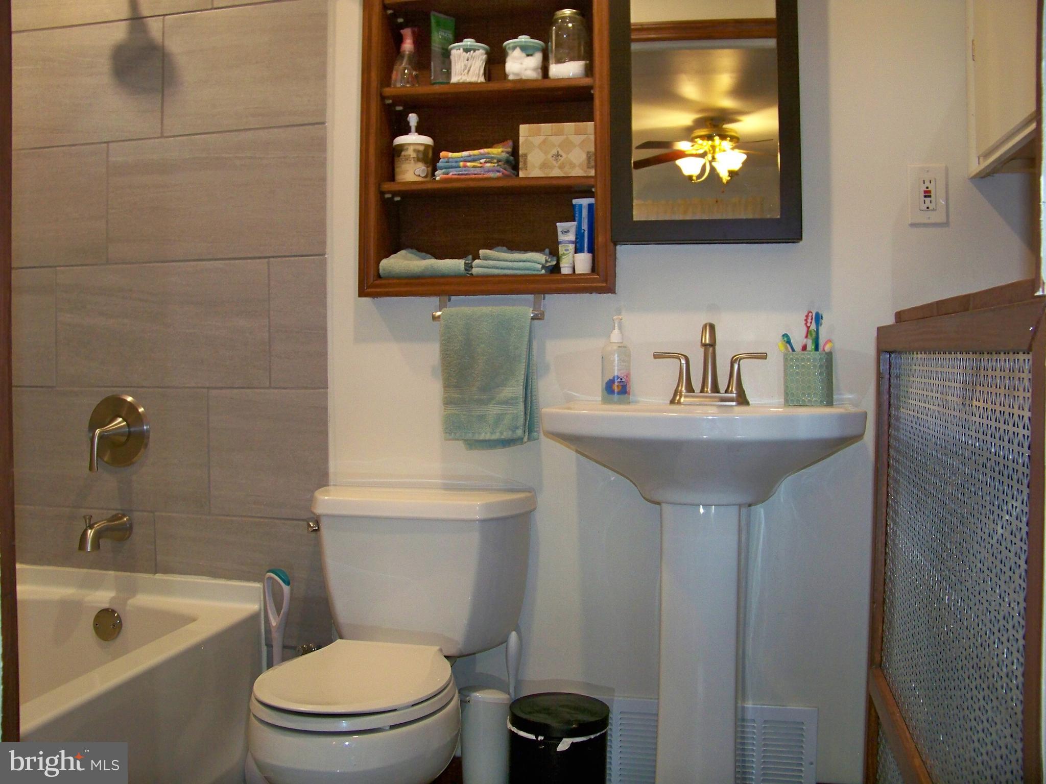 25 Granite Road Levittown, PA 19057 - Photo 16 of 29 Tile work, & pedestal Sink w/cabinet storage
