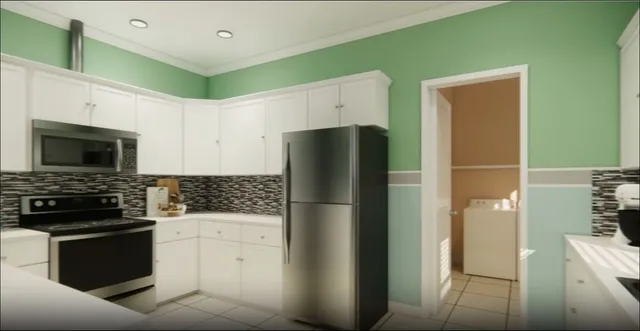 a kitchen with white cabinets and stainless steel appliances