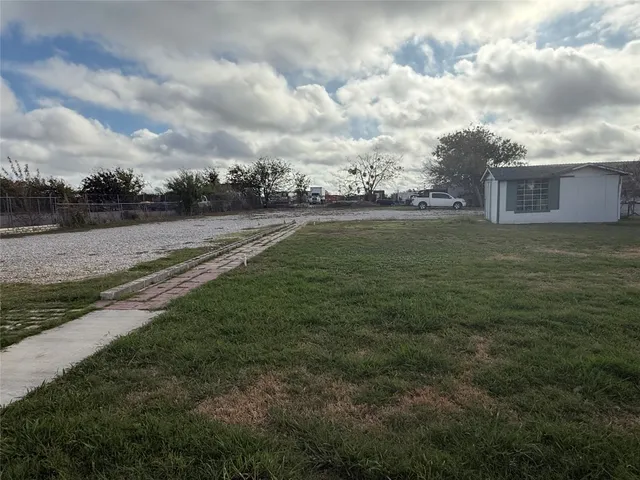 a view of field with river in front of it