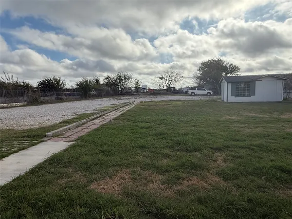 a view of field with river in front of it