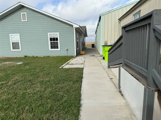 a view of a backyard of the house