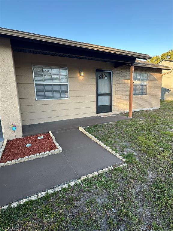 7601 Como Drive New Port Richey, FL 34655 - Photo 1 of 1 a front view of a house with garden