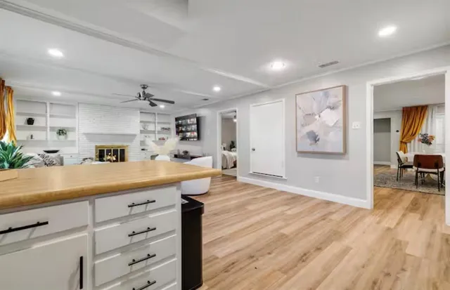 a kitchen with cabinets and stainless steel appliances