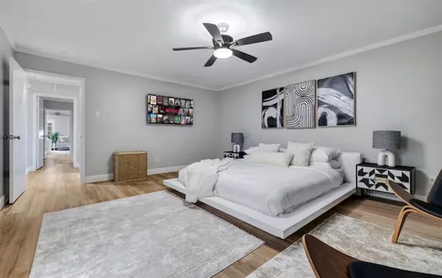 a bedroom with a bed and a couch