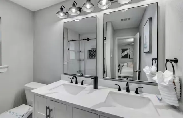 a bathroom with a sink and a mirror