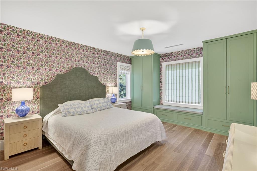111 Caribbean Road Naples, FL 34108 - Photo 37 of 50 a bedroom with a bed and a window