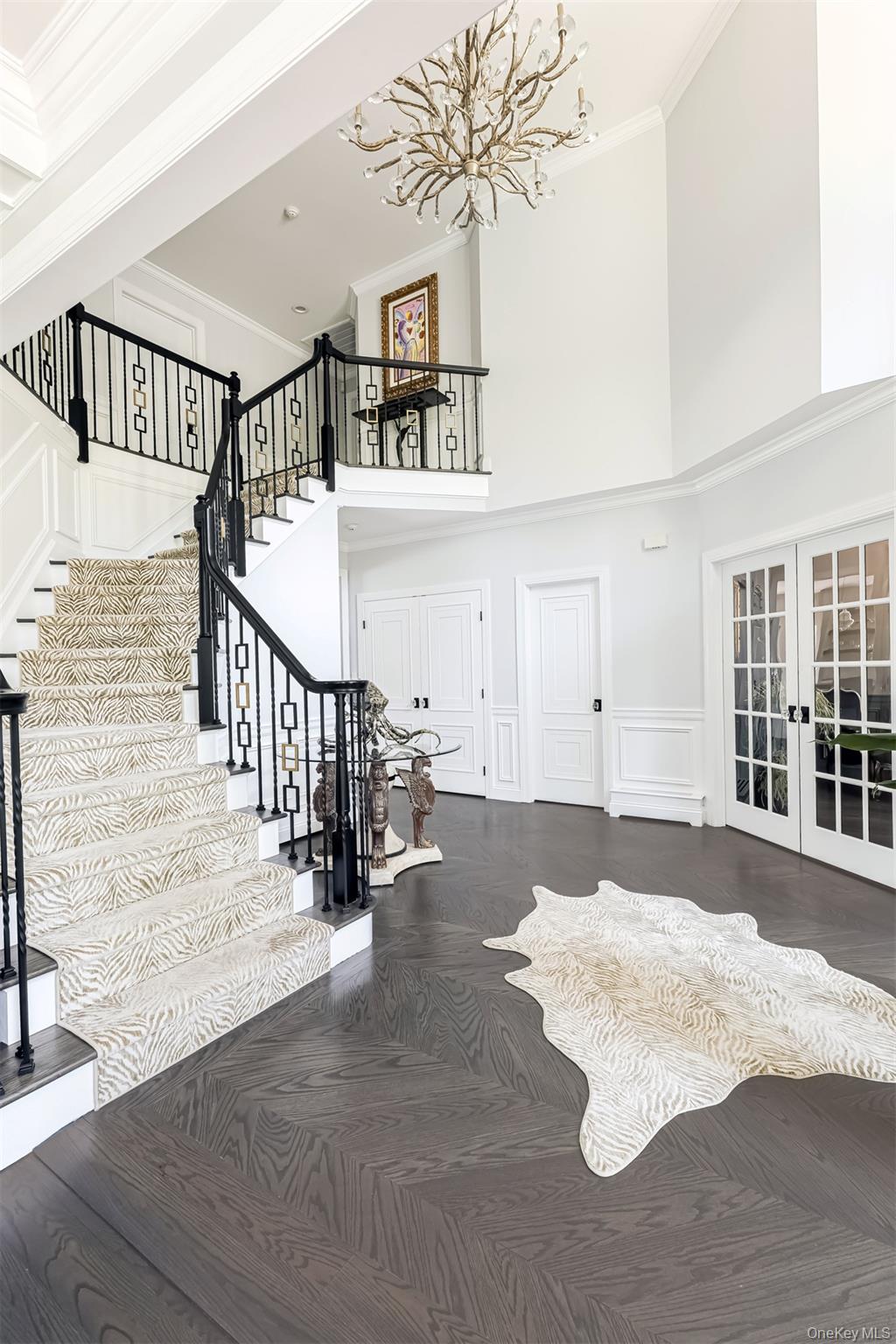 6 Par Road Suffern, NY 10901 - Photo 15 of 41 a view of staircase with lots of frames and a rug