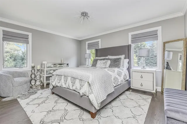 a bedroom with a large bed and a window