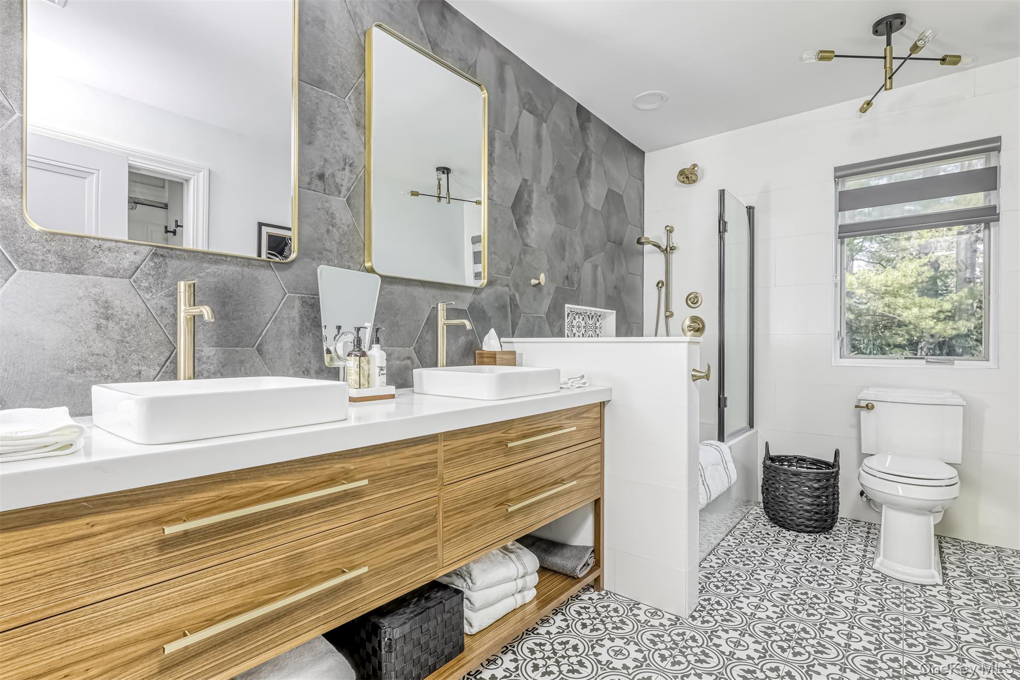 6 Par Road Suffern, NY 10901 - Photo 23 of 41 a bathroom with a sink a toilet a mirror and shower