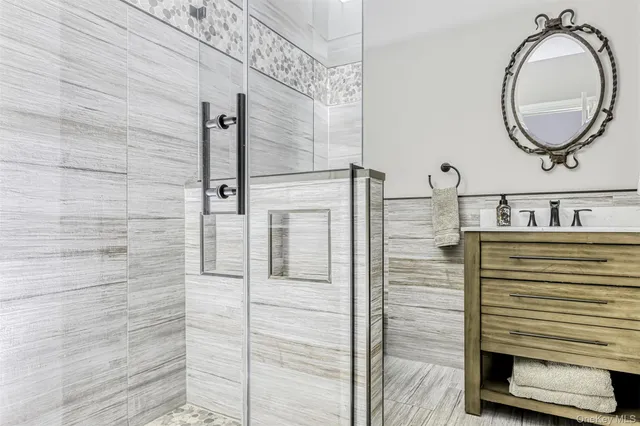 a bathroom with a sink and a mirror