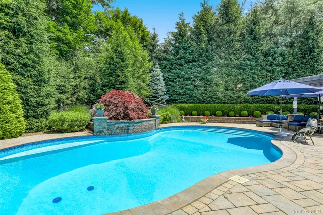 a view of pool and chairs in patio