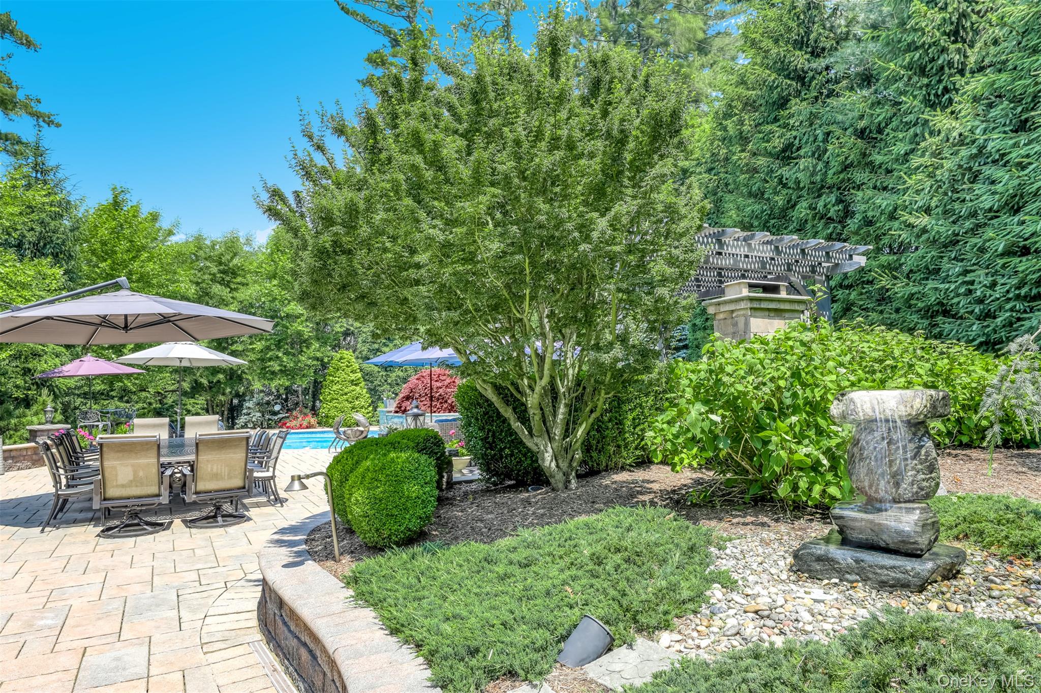 6 Par Road Suffern, NY 10901 - Photo 32 of 41 a view of a garden with plants and a bench