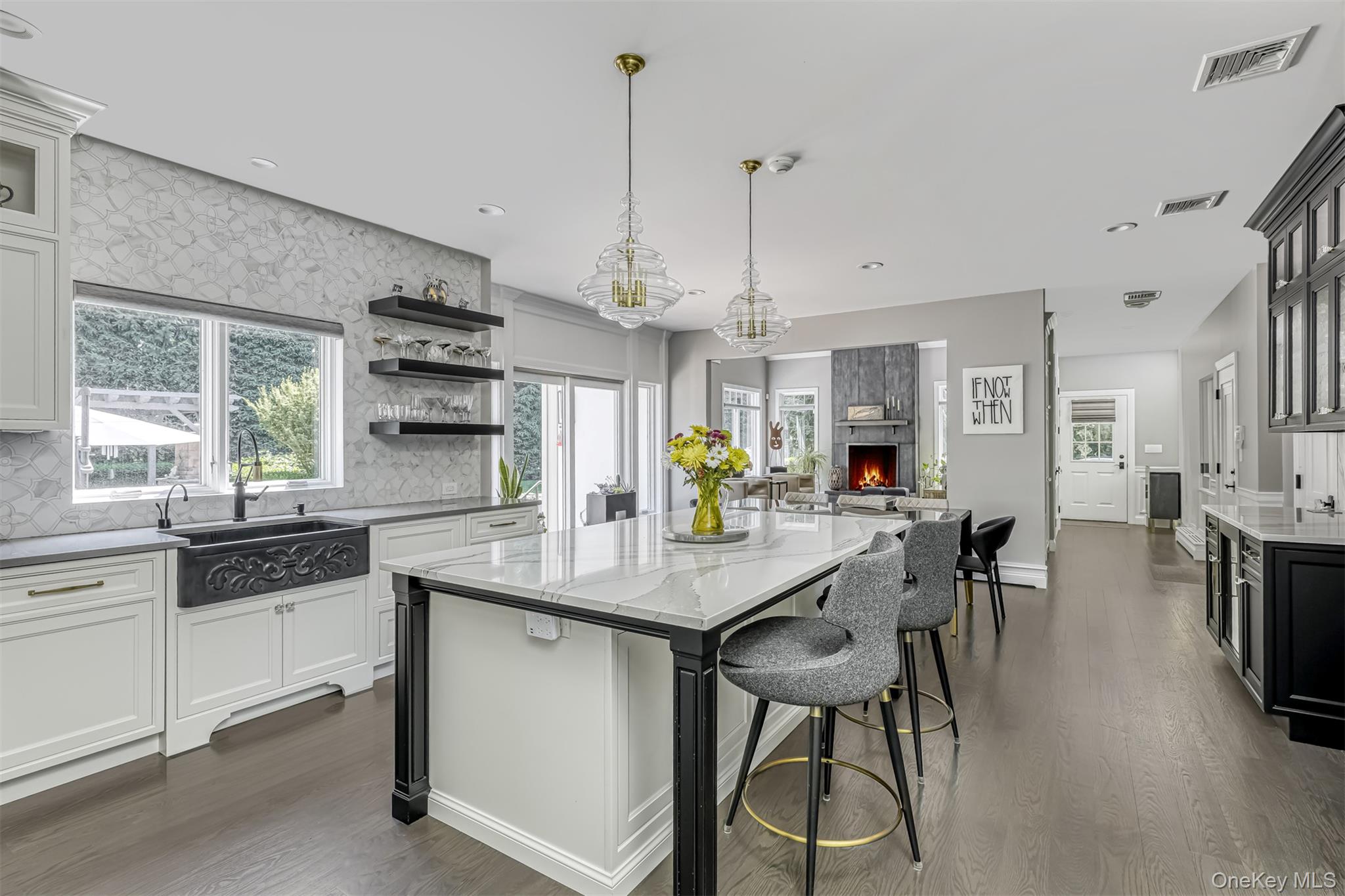 6 Par Road Suffern, NY 10901 - Photo 10 of 41 a kitchen with stainless steel appliances kitchen island granite countertop a table chairs and white cabinets