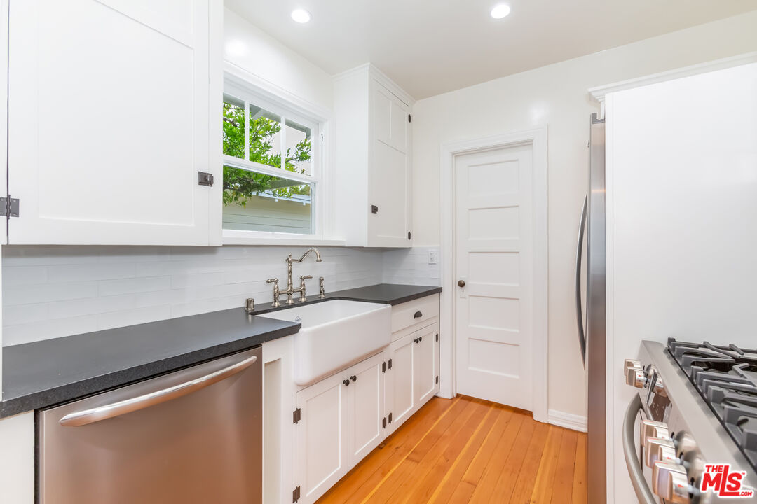 9980 Braddock Drive Culver City, CA 90232 - Photo 18 of 29 a kitchen with stainless steel appliances a stove a sink and a refrigerator