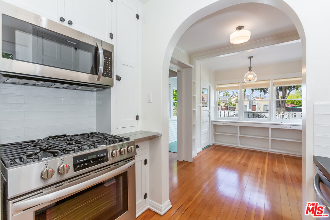 9980 Braddock Drive Culver City, CA 90232 - Photo 19 of 29 a kitchen with a stove and a microwave