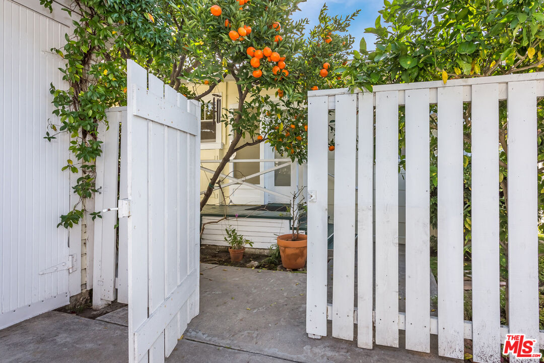 9980 Braddock Drive Culver City, CA 90232 - Photo 2 of 29 a view of a house with backyard and trees