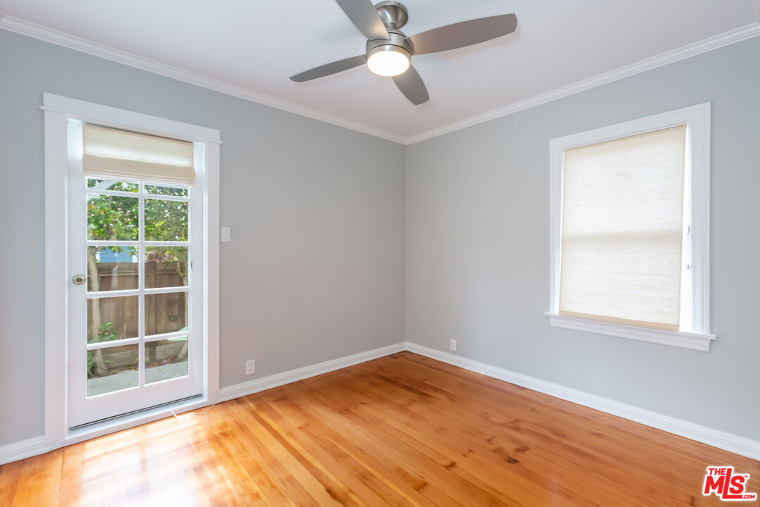 9980 Braddock Drive Culver City, CA 90232 - Photo 21 of 29 a view of empty room with wooden floor and fan