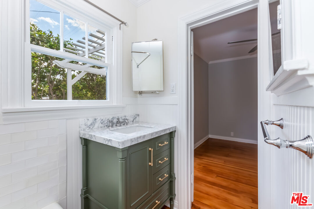 9980 Braddock Drive Culver City, CA 90232 - Photo 24 of 29 a bathroom with a sink a vanity and a mirror