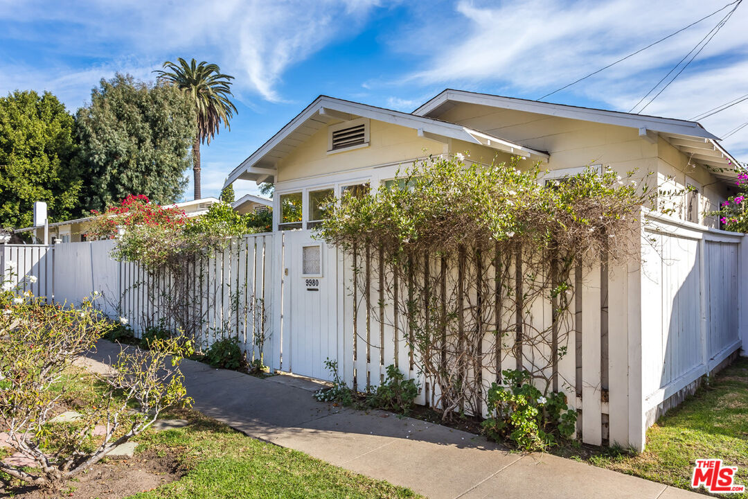 9980 Braddock Drive Culver City, CA 90232 - Photo 3 of 29 a front view of a house with a yard and potted plants