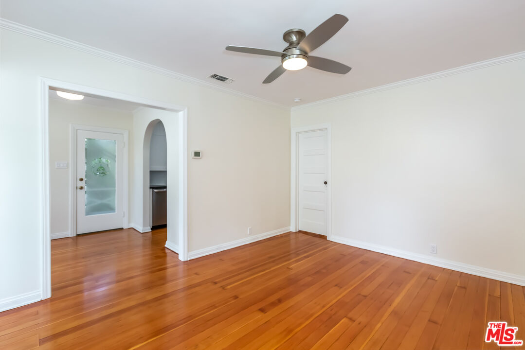 9980 Braddock Drive Culver City, CA 90232 - Photo 8 of 29 an empty room with wooden floor and windows