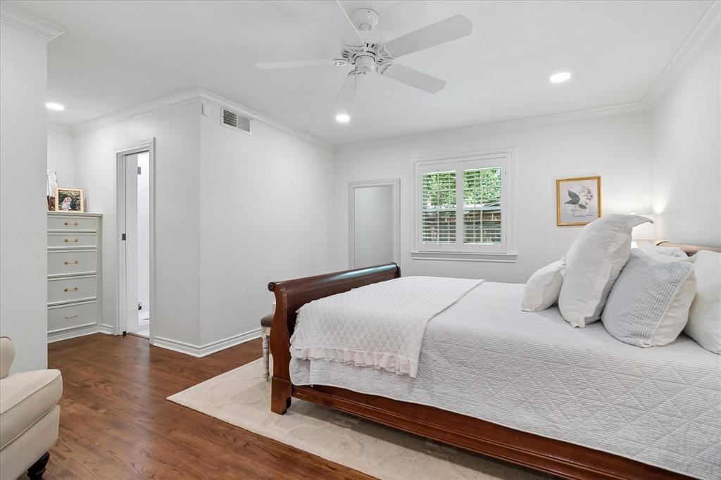 11439 Rosser Road Dallas, TX 75229 - Photo 17 of 35 a bedroom with a large bed and wooden floor
