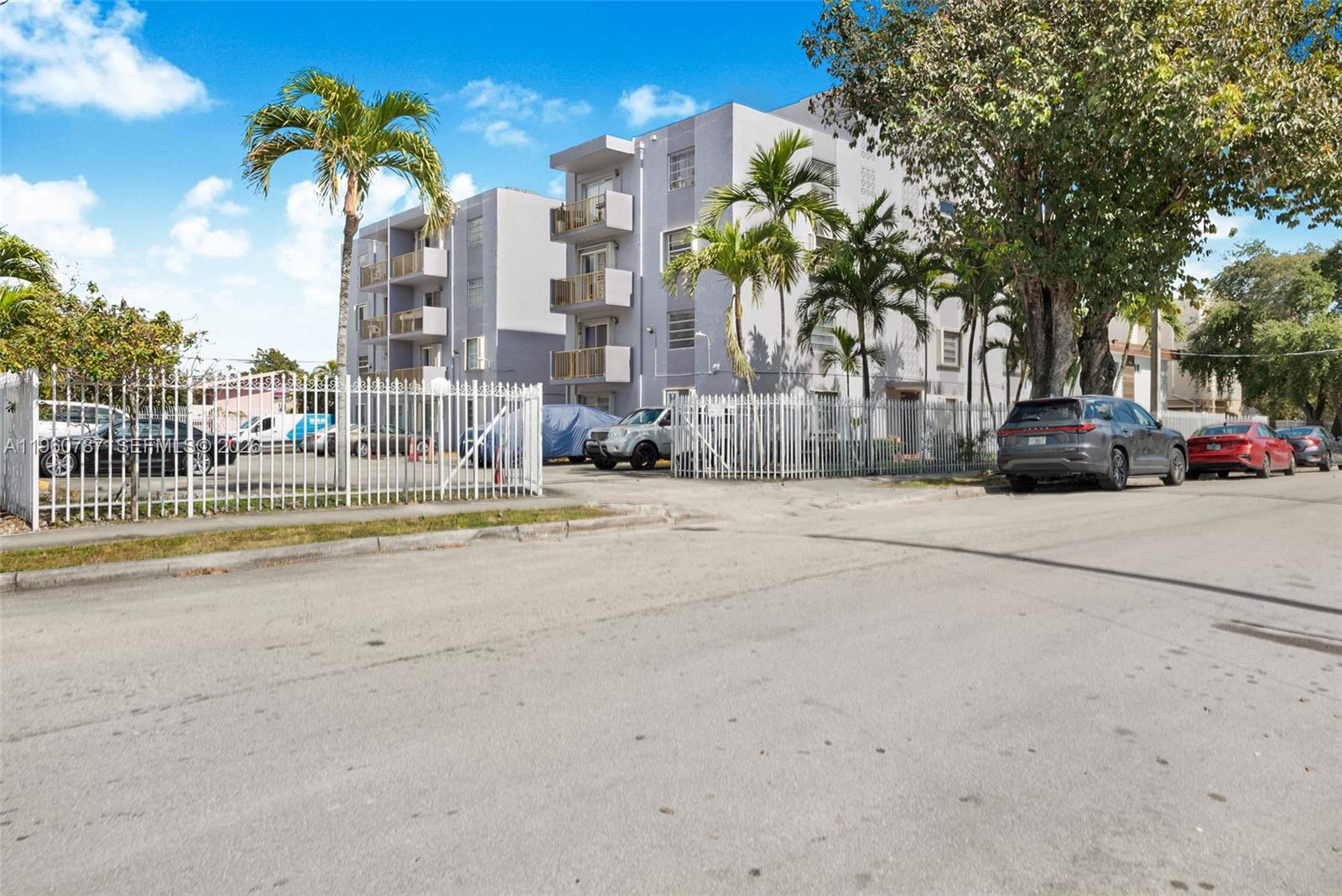 1661 Southwest 3rd Street, Unit 25 Miami, FL 33135 - Photo 22 of 24 a view of a street with a cars parked in front of it