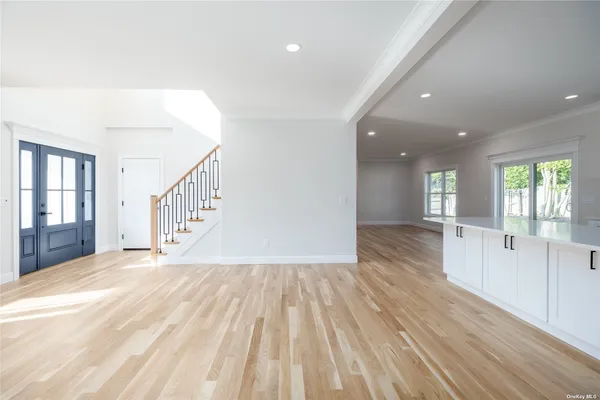 wooden floor with windows in an empty room