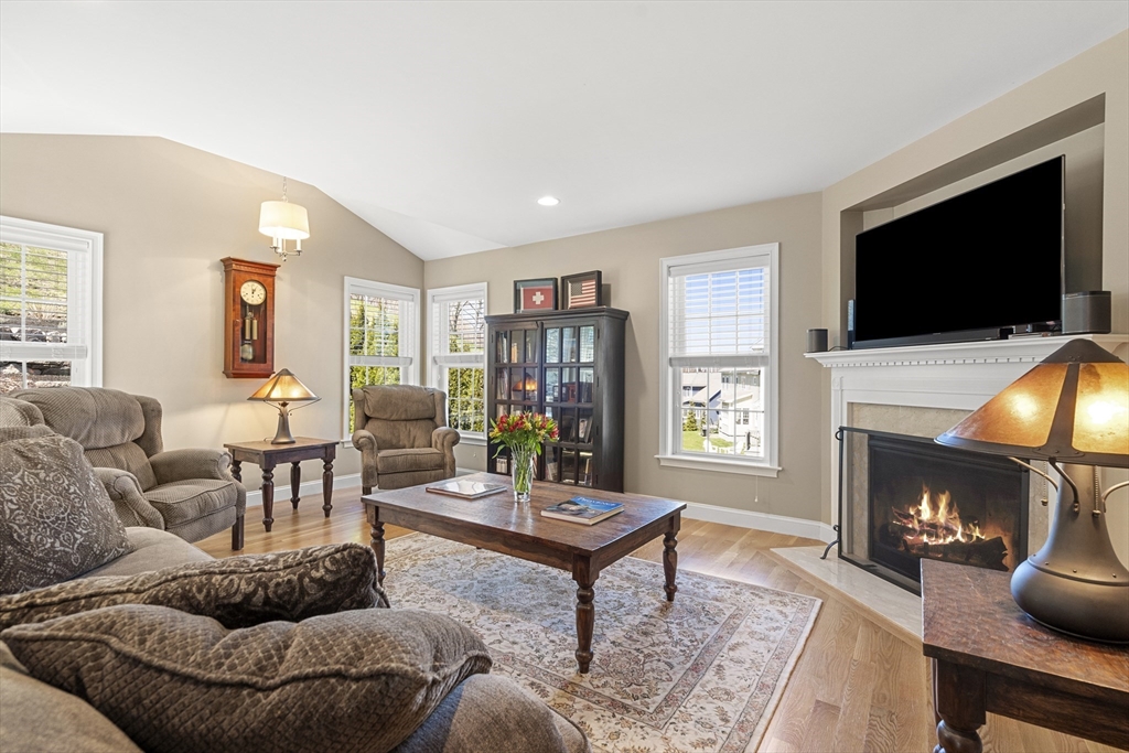 62 Leggs Hill Road Marblehead, MA 01945 - Photo 12 of 36 a living room with furniture a flat screen tv and a fireplace
