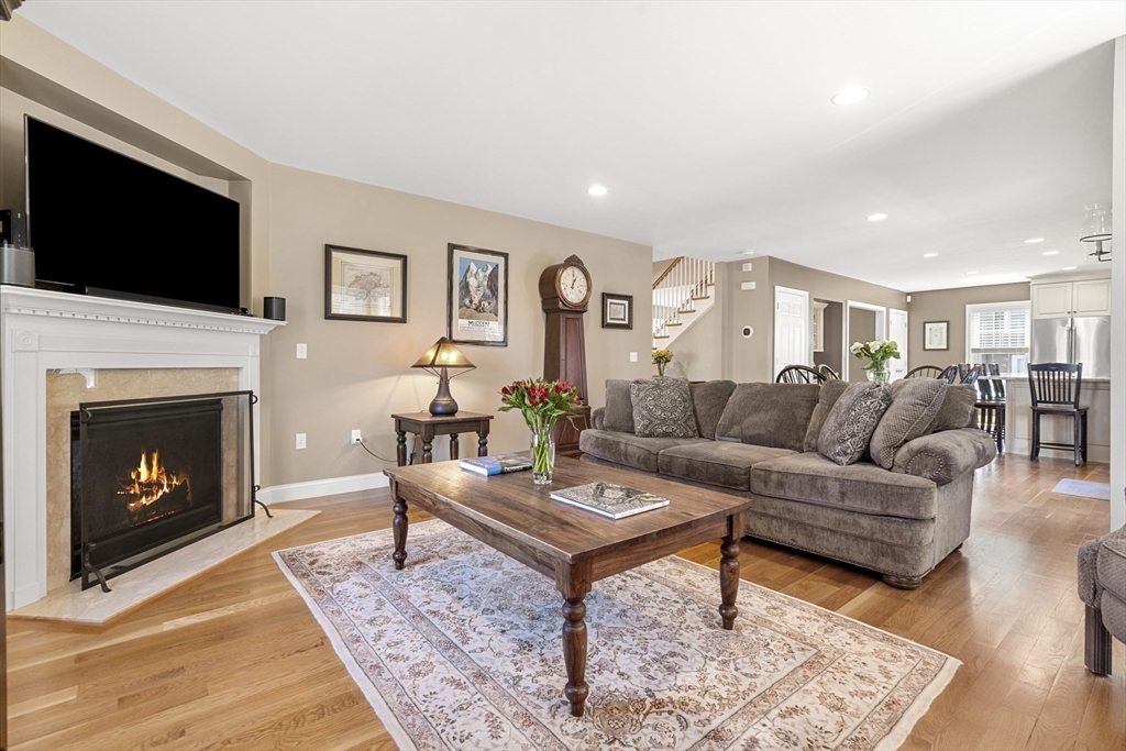 62 Leggs Hill Road Marblehead, MA 01945 - Photo 13 of 36 a living room with furniture a flat screen tv and a fireplace