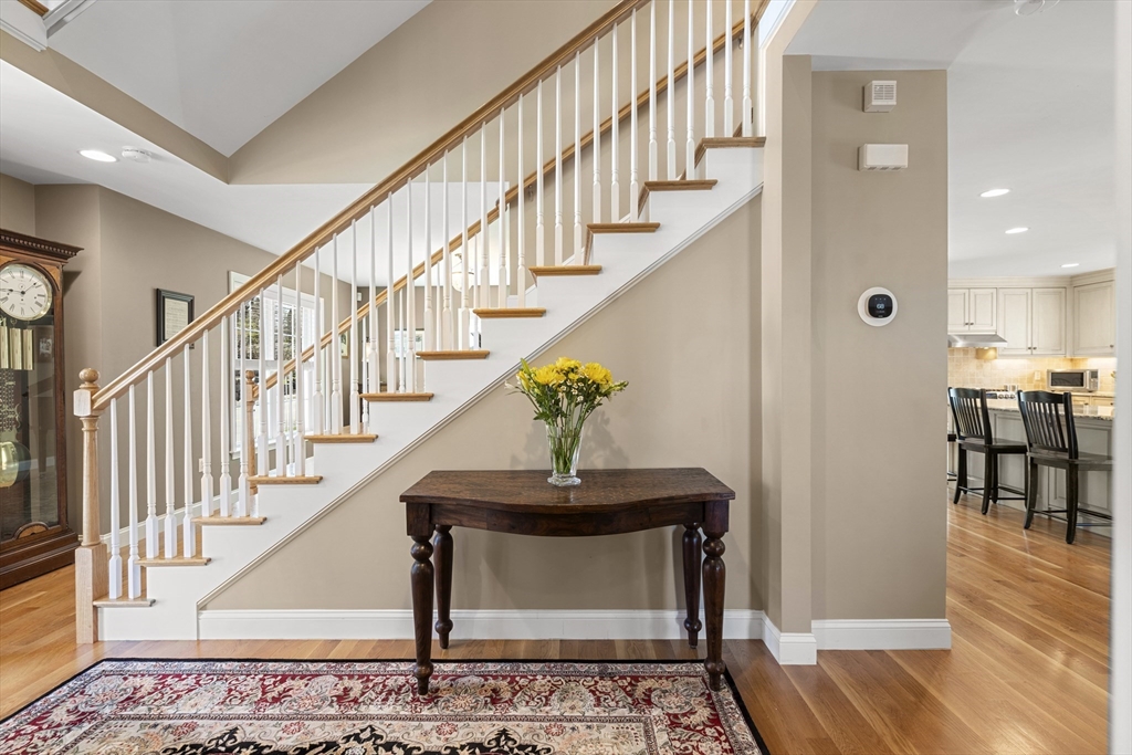 62 Leggs Hill Road Marblehead, MA 01945 - Photo 15 of 36 a view of staircase with dining table and a rug