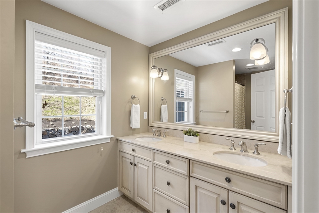 62 Leggs Hill Road Marblehead, MA 01945 - Photo 21 of 36 a bathroom with a sink and a mirror