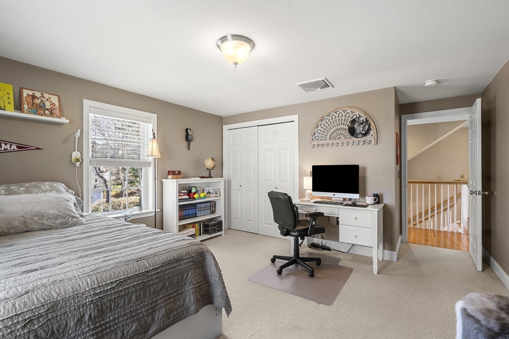 62 Leggs Hill Road Marblehead, MA 01945 - Photo 23 of 36 a bedroom with a large bed and a desk