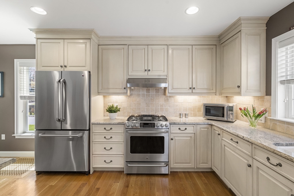 62 Leggs Hill Road Marblehead, MA 01945 - Photo 5 of 36 a kitchen with granite countertop white cabinets and stainless steel appliances