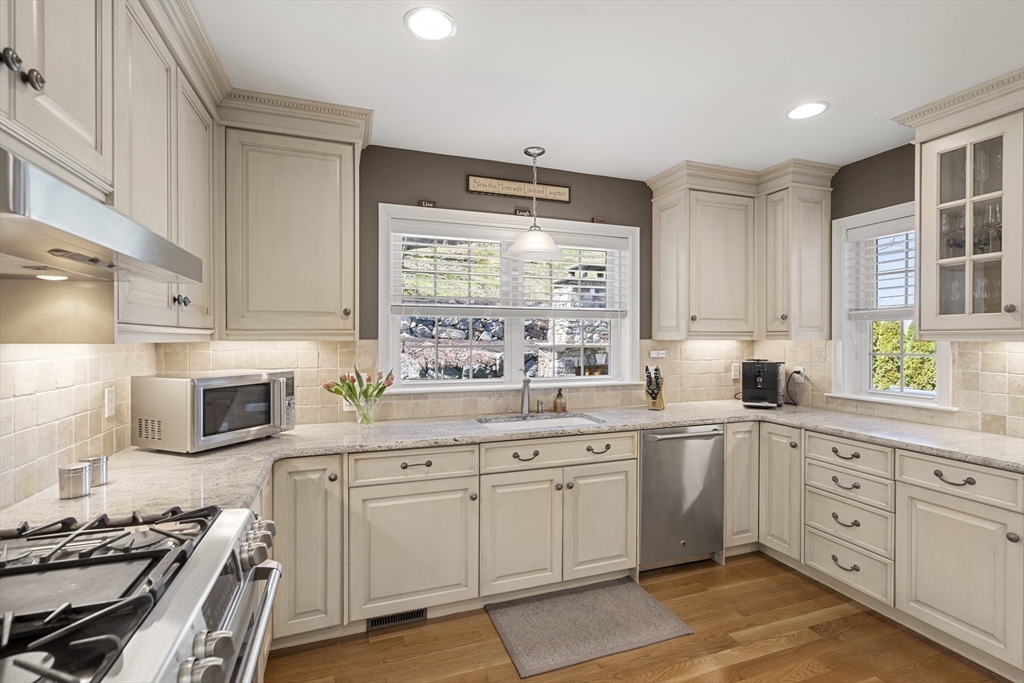 62 Leggs Hill Road Marblehead, MA 01945 - Photo 6 of 36 a kitchen with white cabinets sink and appliances