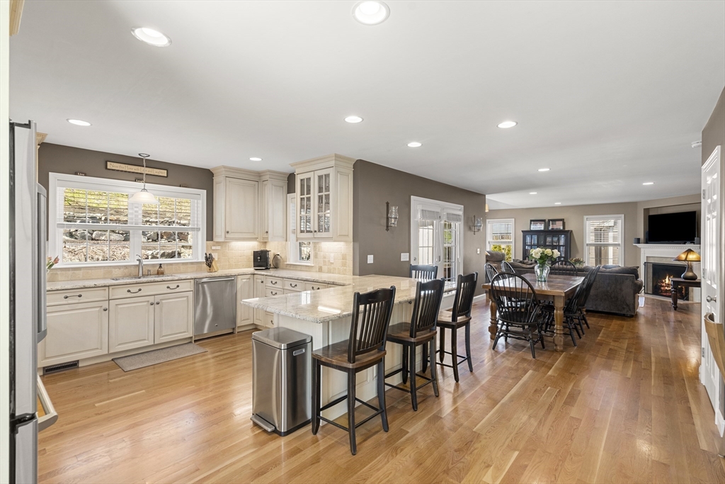 62 Leggs Hill Road Marblehead, MA 01945 - Photo 9 of 36 a large kitchen with a table and chairs in it