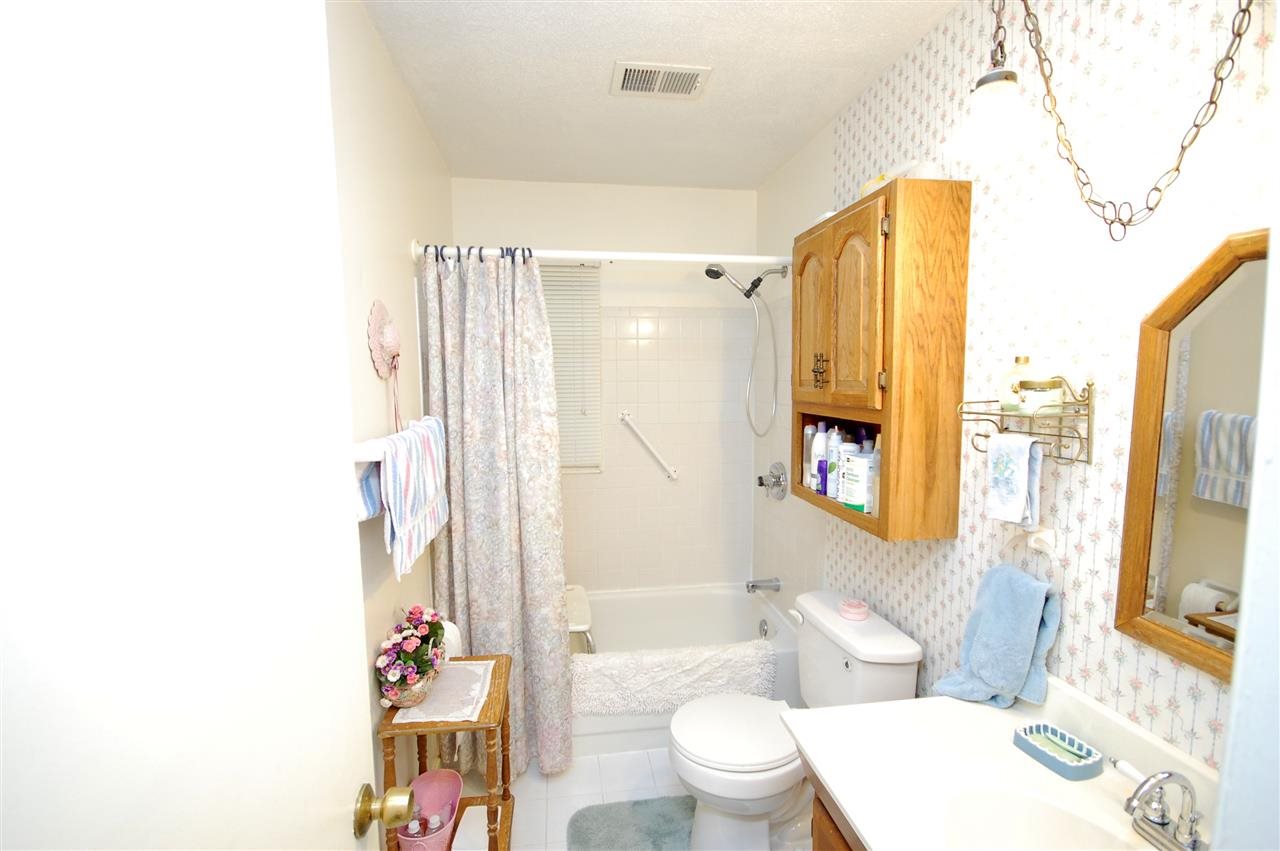 3029 Sienna Road Bartlett, TN 38134 - Photo 11 of 20 a bathroom with a toilet a sink and a large mirror