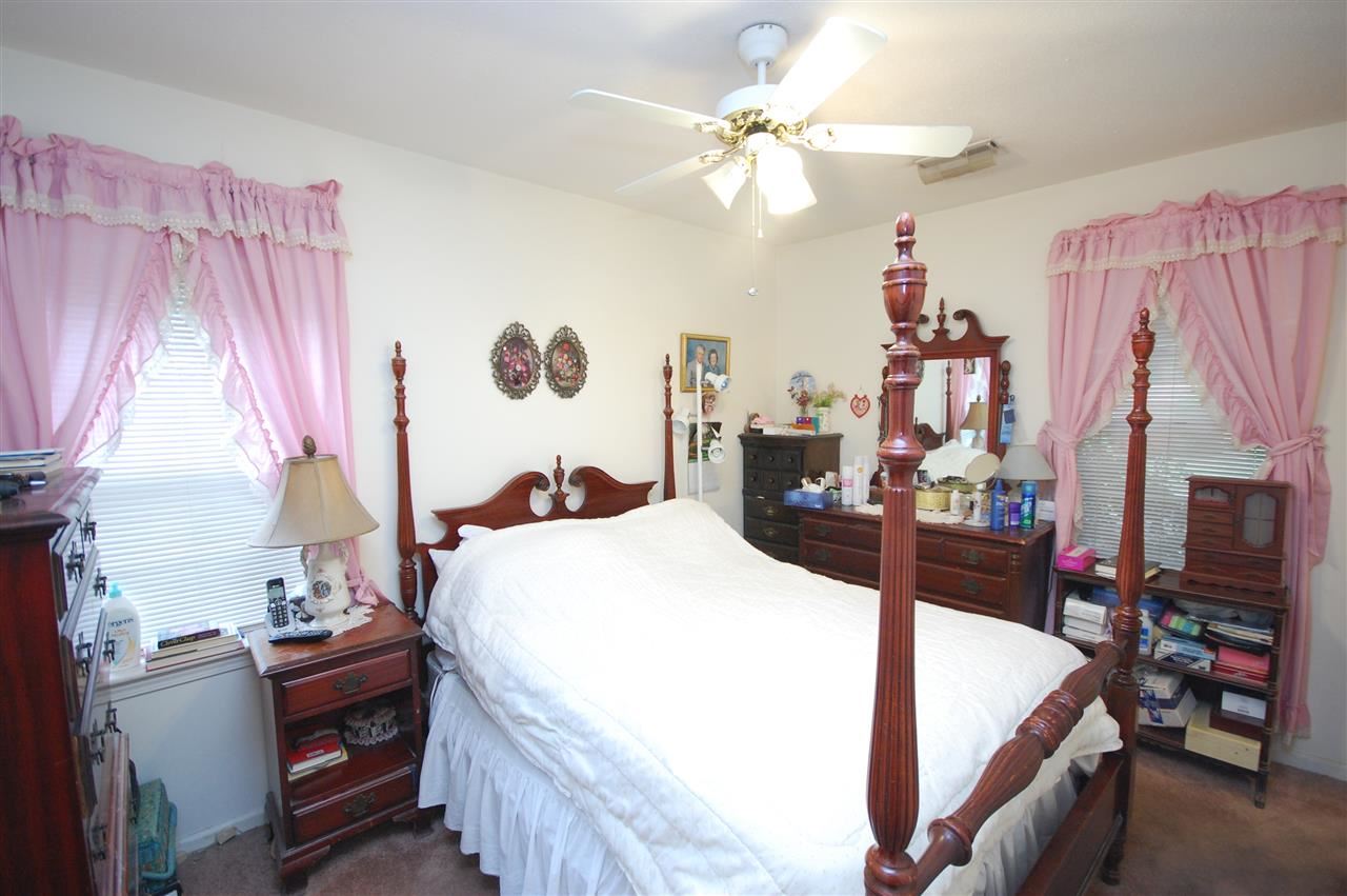 3029 Sienna Road Bartlett, TN 38134 - Photo 12 of 20 a bed room with a bed and a chandelier