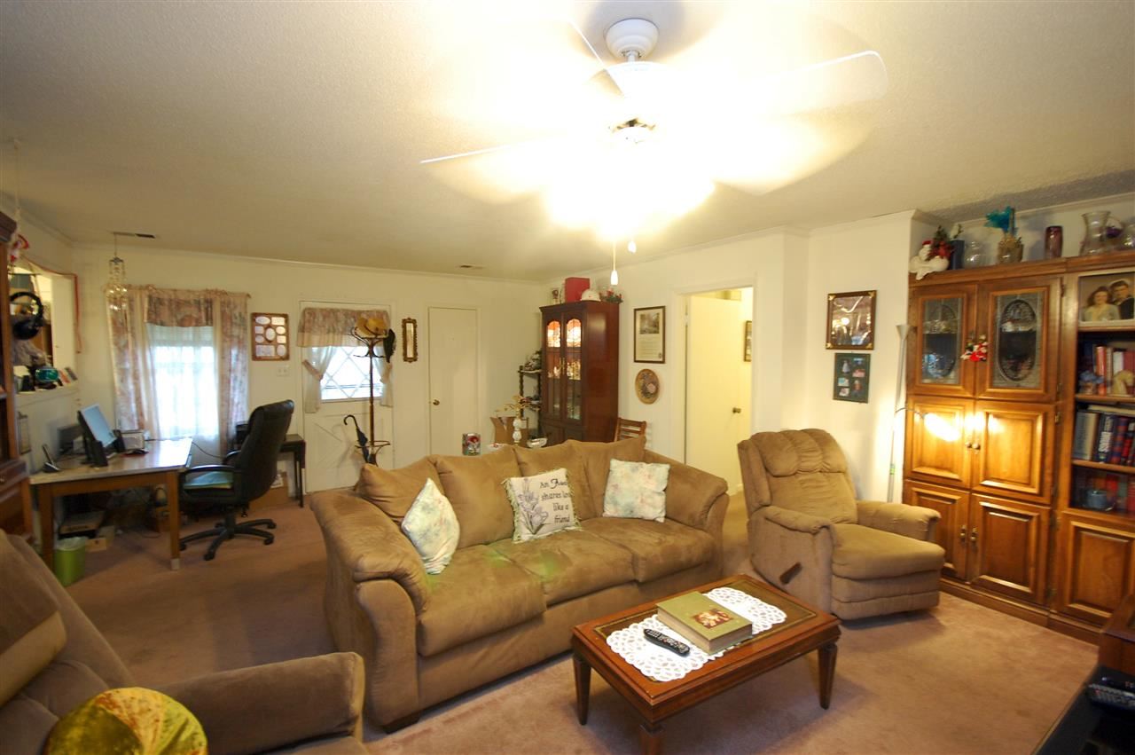 3029 Sienna Road Bartlett, TN 38134 - Photo 3 of 20 a living room with furniture kitchen view and a chandelier