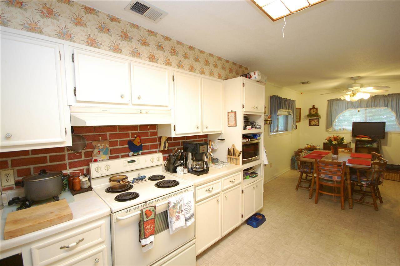 3029 Sienna Road Bartlett, TN 38134 - Photo 7 of 20 a kitchen with a stove a refrigerator and cabinets