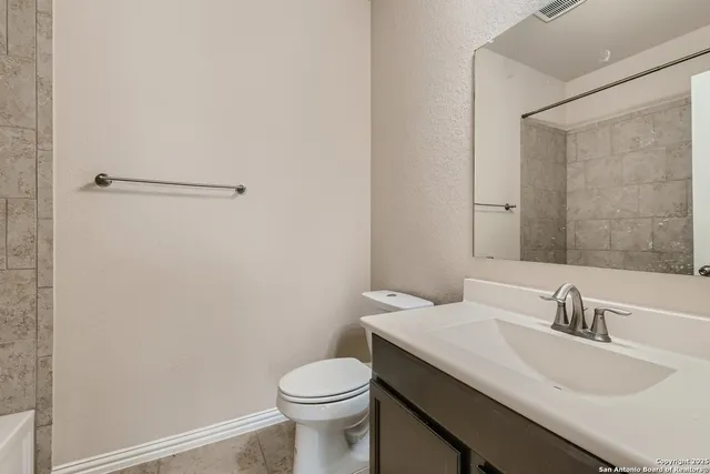 a bathroom with a sink and a toilet