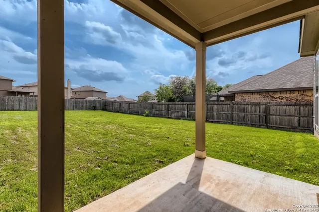 a view of a backyard with a garden and plants