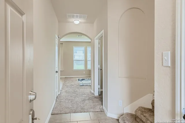 a view of a bathroom from a hallway