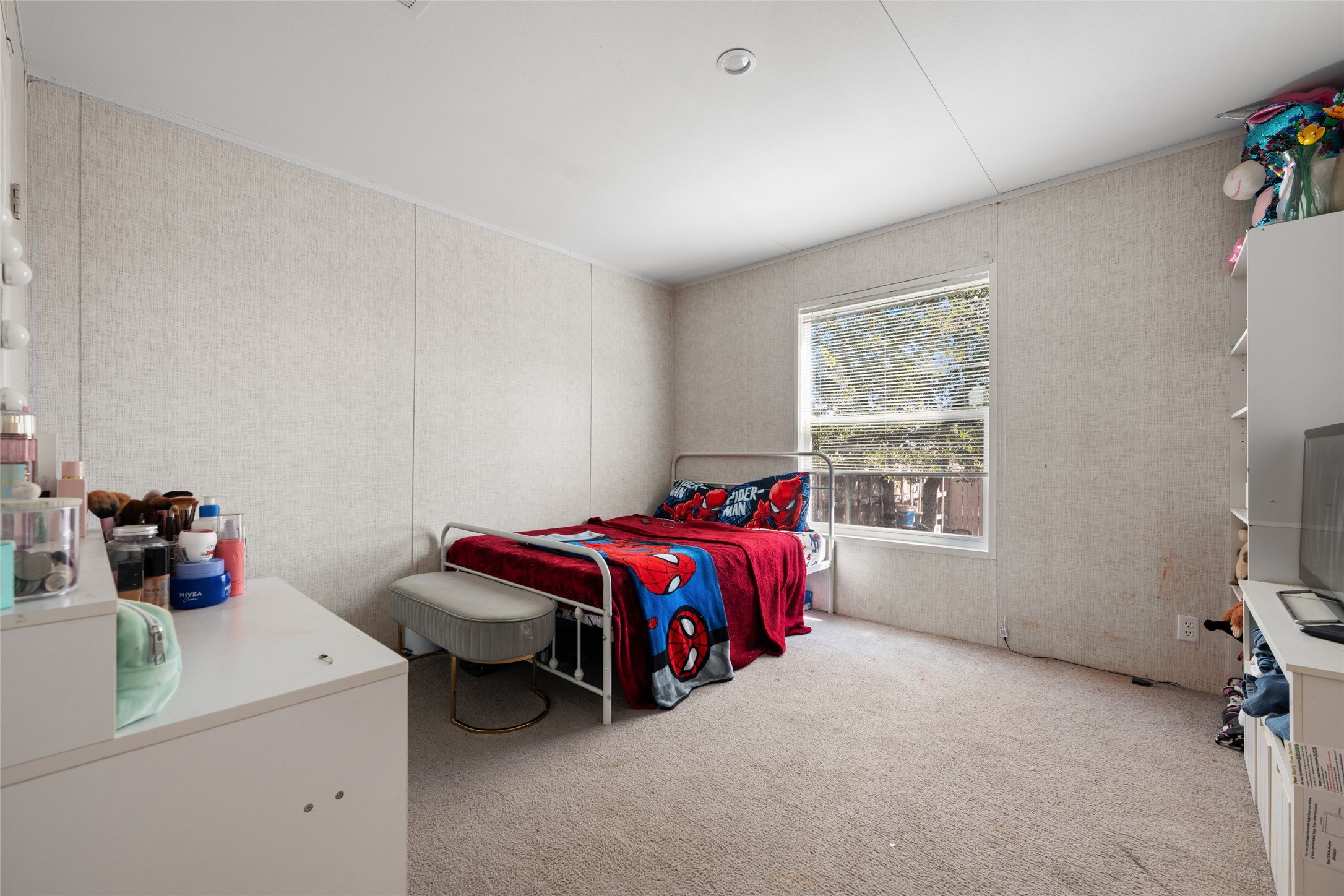 113 Sunflower Road Dale, TX 78616 - Photo 20 of 33 A window brings natural light into this bedroom featuring soft carpeting.