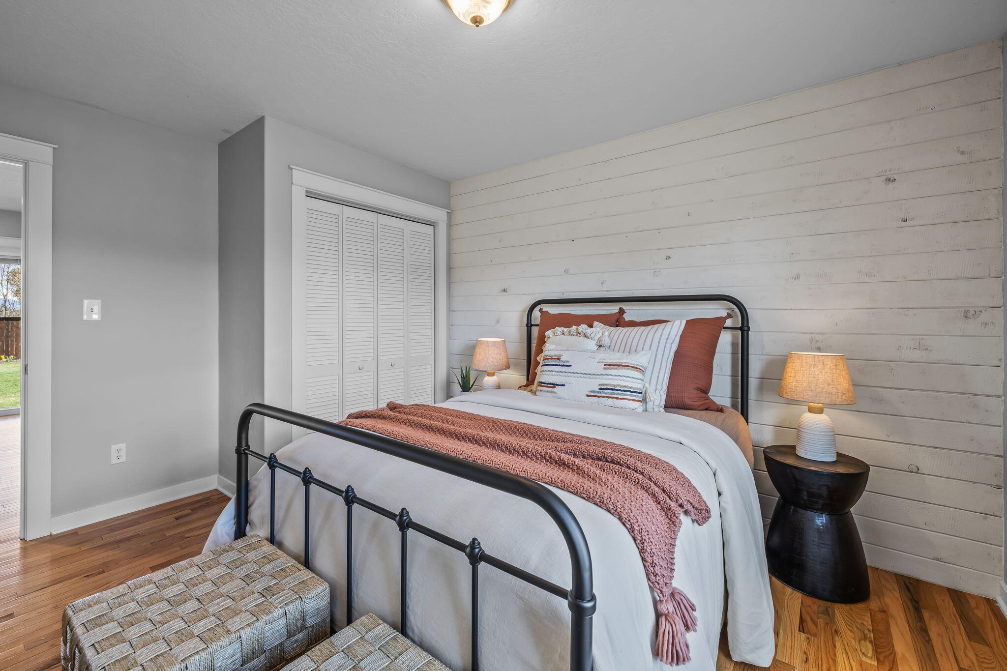 61600 Ward Road Bend, OR 97702 - Photo 31 of 52 a bedroom with a bed and wooden floor