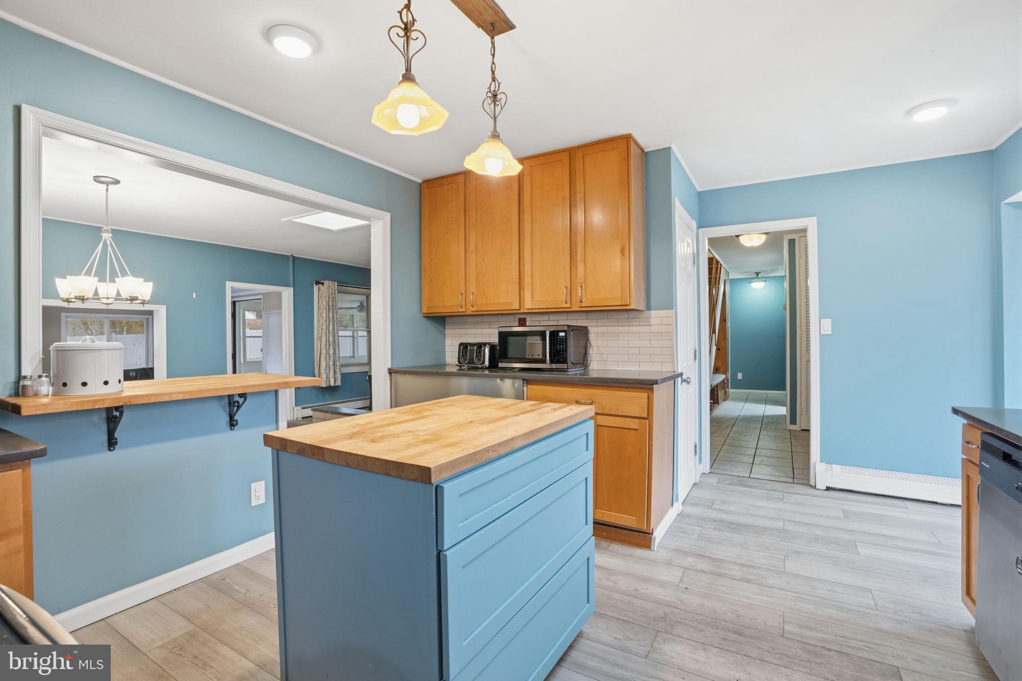 80 Silverspruce Road Levittown, PA 19056 - Photo 12 of 31 a kitchen with stainless steel appliances granite countertop wooden cabinets a stove a sink and a refrigerator