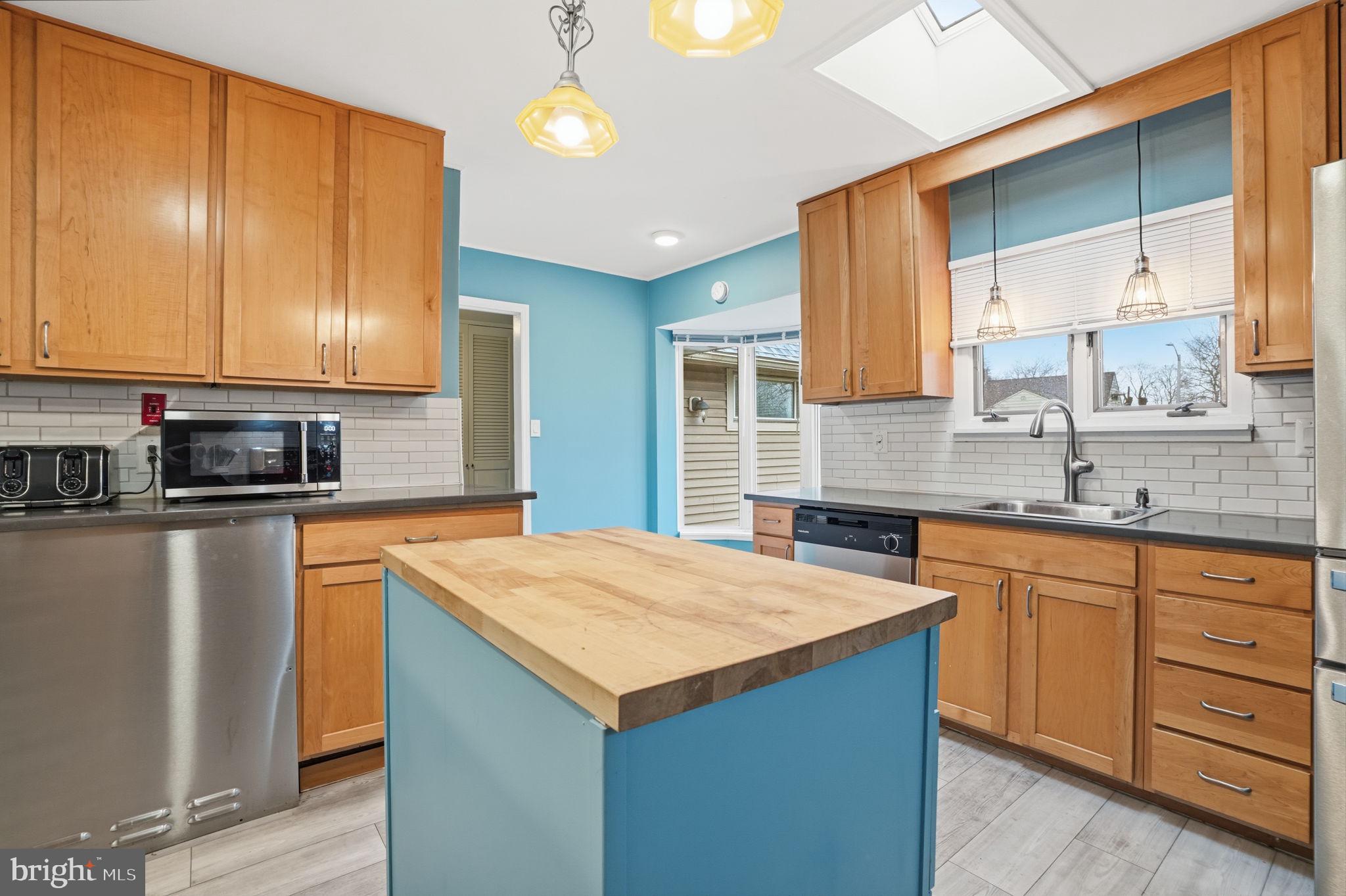 80 Silverspruce Road Levittown, PA 19056 - Photo 13 of 31 a kitchen with stainless steel appliances granite countertop a sink stove and refrigerator