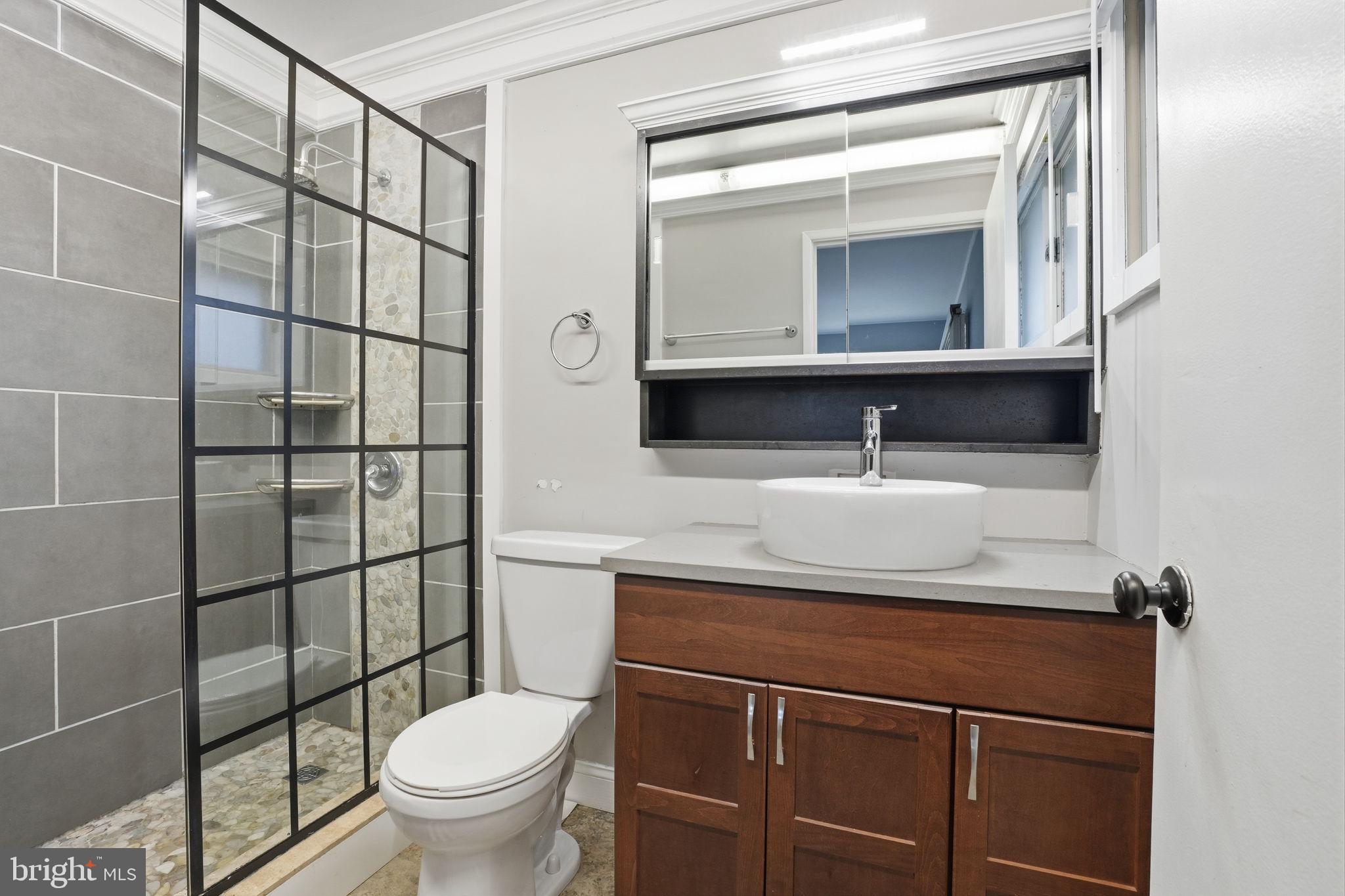 80 Silverspruce Road Levittown, PA 19056 - Photo 17 of 31 a bathroom with a sink toilet and mirror